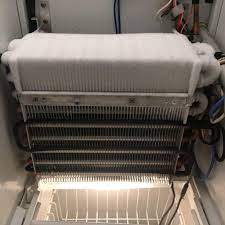 Emergency refrigerator repair showing oven repair work