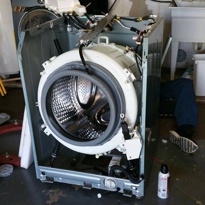 Professional washer repair service showing Bosch washing machine repair